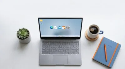 Best laptop under 40000 India 2026 guide showing modern laptop on desk with notebook and coffee for students and professionals.